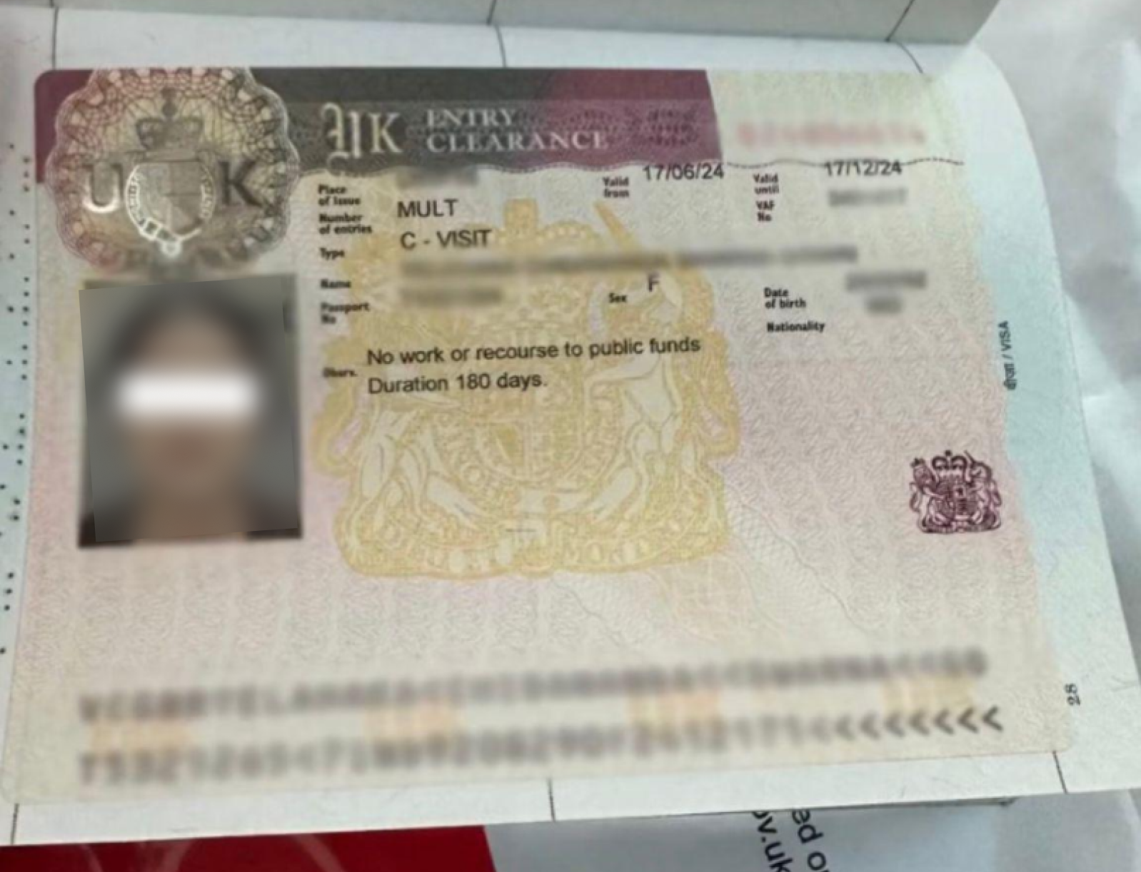 United Kingdom Entry Clearance — approved client passport (personal details redacted)